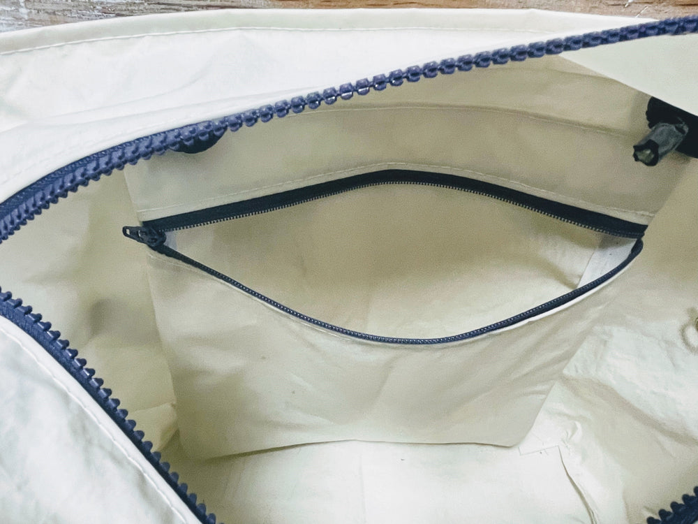 
            
                Load image into Gallery viewer, Recycled Sailcloth White Lobster Travel Bag with Trolley Sleeve
            
        